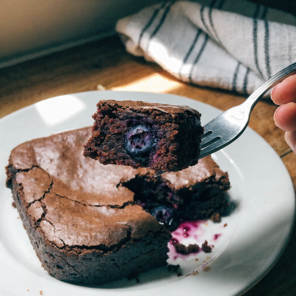 Close-up of blueberry brownies with fresh blueberry pockets